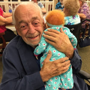 old man with doll